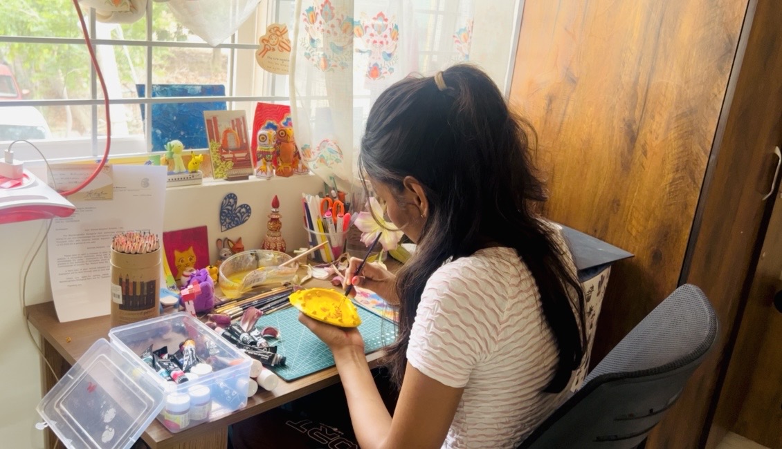 Aiswarya painting in her studio